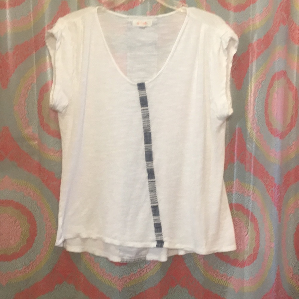 White top with stripe pattern down middle